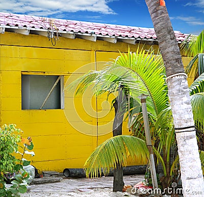 Caribbean tropical yellow beach wooden house Stock Photo