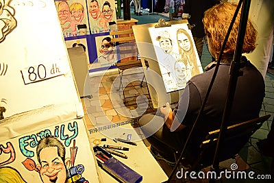 Caricature artist at Global village dubai Editorial Stock Photo