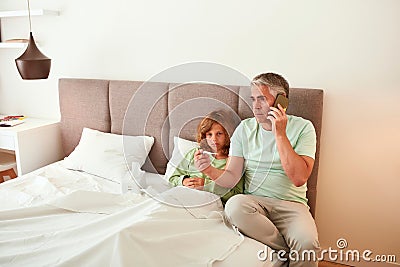 Caring dad call ambulance for sick teen son Stock Photo