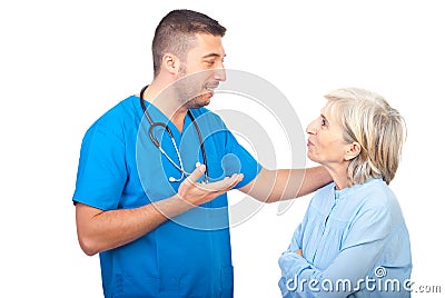 Caring doctor give explanation to senior woman Stock Photo