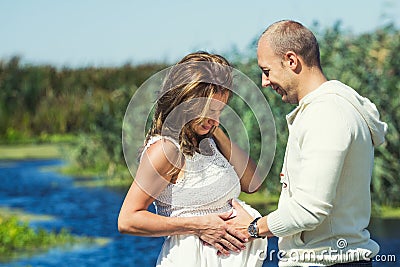 Caring husband with his pregnant wife Stock Photo