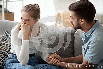 Caring husband hold wife hand making peace after fight Stock Photo