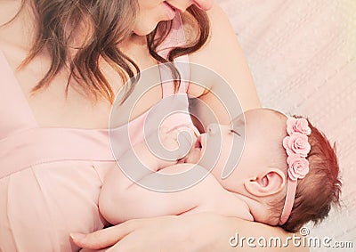 Caring mother holding with love her little cute sleeping baby gi Stock Photo