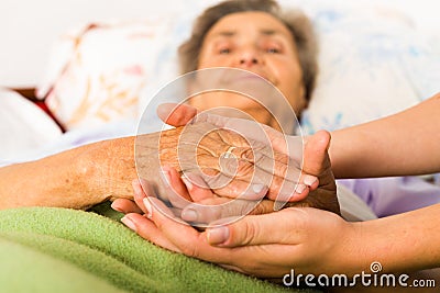 Caring Nurse Holding Hands Stock Photo