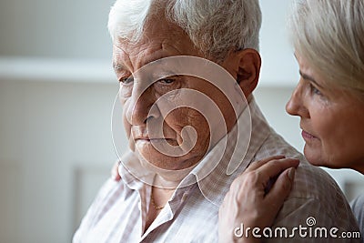 Caring old wife support caress sad senior husband Stock Photo