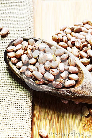 Carioca beans in a wooden spoon. Brazilian beans Stock Photo