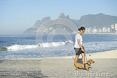 Carioca Brazilian Woman Walking Dog in Rio Editorial Stock Photo