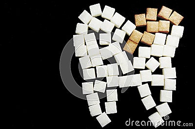 The carious tooth of sugar cubes of refined sugar, preventing tooth decay, caring for the health of your teeth Stock Photo