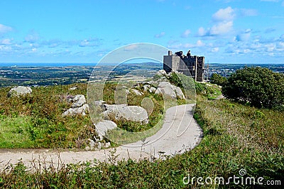 View over Carn Brea Castle and Redruth towards St Agnes Head from Carn Brea, Cornwall Stock Photo