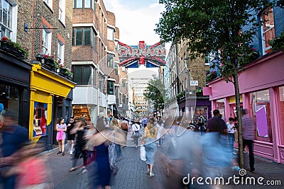 Carnaby Street In London UK With Motion Blurred Shoppers Editorial Stock Photo
