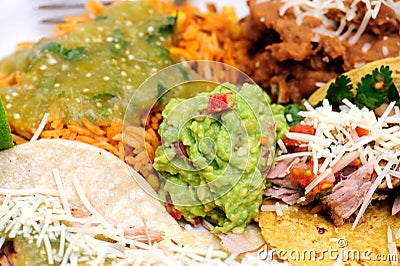 Carnitas With Rice And Refried Beans Stock Photo