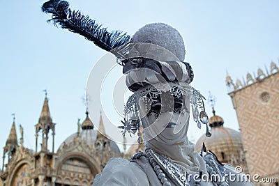 Carnival blue-silver mask and costume at the traditional festival in Venice, Italy Editorial Stock Photo