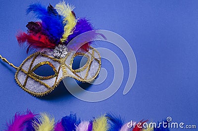 Carnival. Festive banner background with copy space. Carnival mask with feathers on a blue background. Mardi Gras. Brazilian Stock Photo