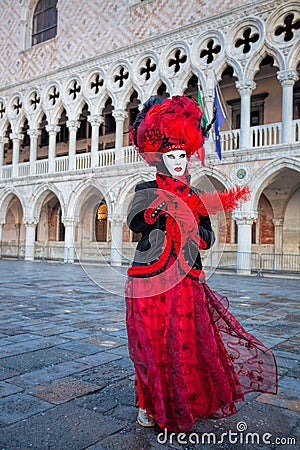 Carnival mask against Doge palace in Venice, Italy Editorial Stock Photo