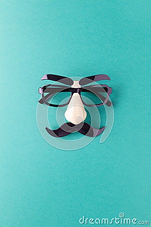 Carnival mask with moustache, nose and glasses on blue background, copy space. Concept Movember, men`s health, prostate cancer Stock Photo