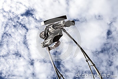 Carnival of Nice, Flowers` battle. An acrobat in businessman suit walking in the sky Editorial Stock Photo
