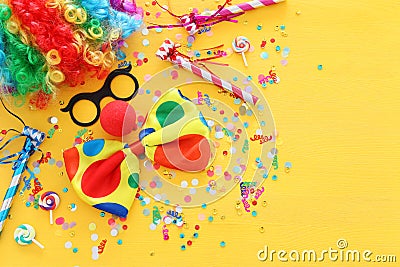 Carnival, party and Purim celebration concept jewish carnival holiday over yellow background Stock Photo