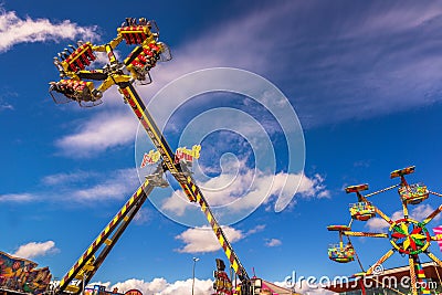 Carnival rides against blue skies Editorial Stock Photo