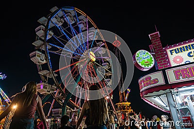 Carnival rides and festival food Editorial Stock Photo