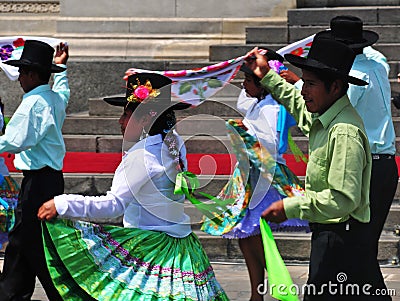 Carnival of Tacna Peru, tradition of Andean migration -couples dancing with multicolored clothes Editorial Stock Photo