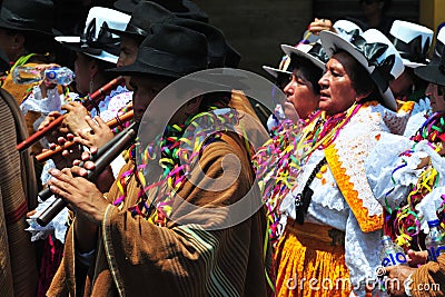 Carnival of Tacna Peru, tradition of Andean migration-couples dancing with multicolored clothes Editorial Stock Photo