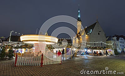 Carousel and Christmas market in Tallinn Editorial Stock Photo