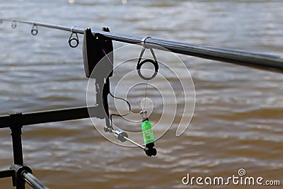 Carp fishing indicator. Warning for fishing, detailed swinger. Stock Photo