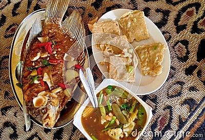 carp with sweet and sour sauce, mendoan tempeh and capcay make the tongue sway when eating it. Stock Photo