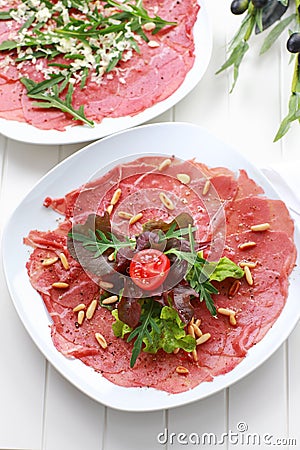 Carpaccio with salad and pine nut Stock Photo