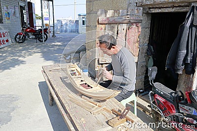 Carpenter artisan make boat model Editorial Stock Photo