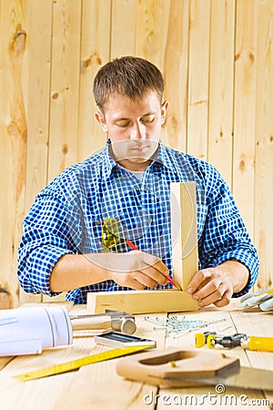 Carpenter does works with pencil Stock Photo