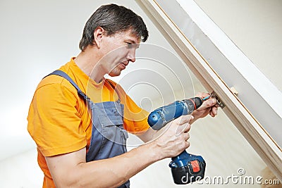 Carpenter at door lock installation Stock Photo