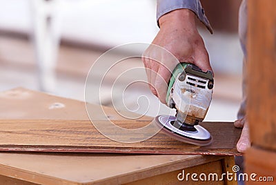 Carpenter drill wood for house construction Stock Photo