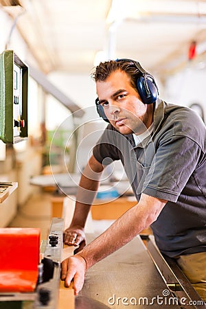 Carpenter with electric cutter Stock Photo