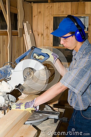 Carpenter & electric saw Stock Photo