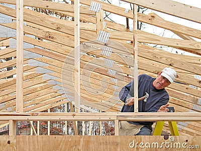 Carpenter framing house Stock Photo