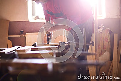 Carpenter gluing wooden planks Stock Photo