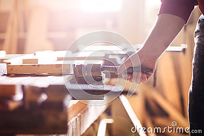 Carpenter gluing wooden planks Stock Photo