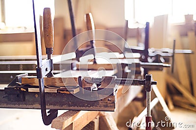 Carpenter gluing wooden planks Stock Photo