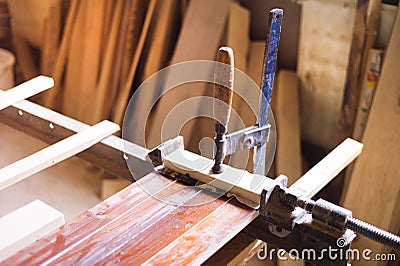 Carpenter gluing wooden planks Stock Photo