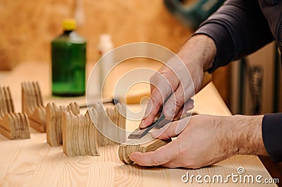 Carpenter hands cutting wood with chisel Stock Photo