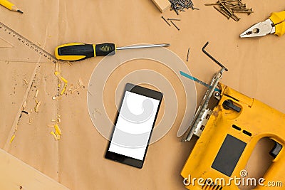 Carpenter handyman workshop desk tabletop with samrt phone Stock Photo