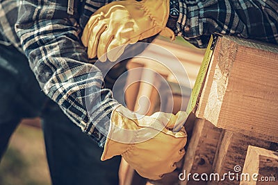 Carpenter Measuring Wood Beams Material Stock Photo