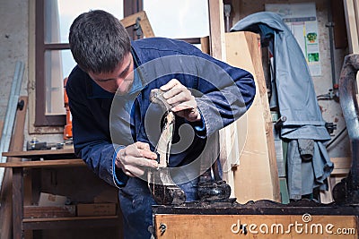 Carpenter restoring Wooden Furniture Stock Photo