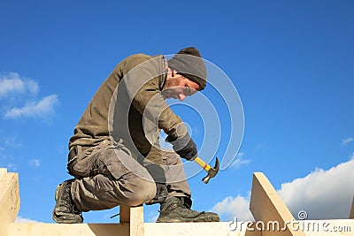 Carpenter on roof Stock Photo