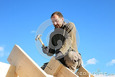 Carpenter on roof Stock Photo