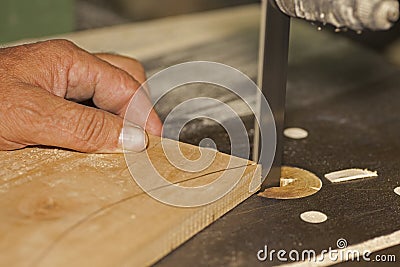 Carpenter sawing Stock Photo