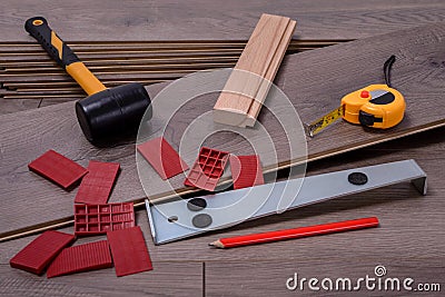 Carpenter tools on laminated flooring Stock Photo