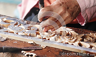 Carpenter uses carved chisels,Carved wood,Use the tool,Folk crafts Stock Photo