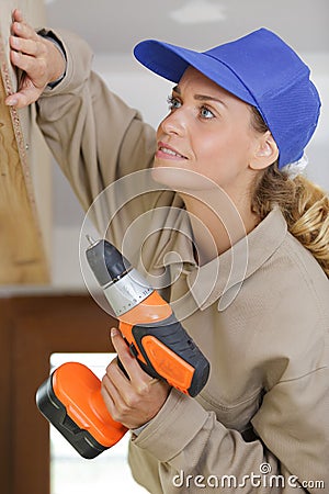 Carpenter using drill on wood Stock Photo